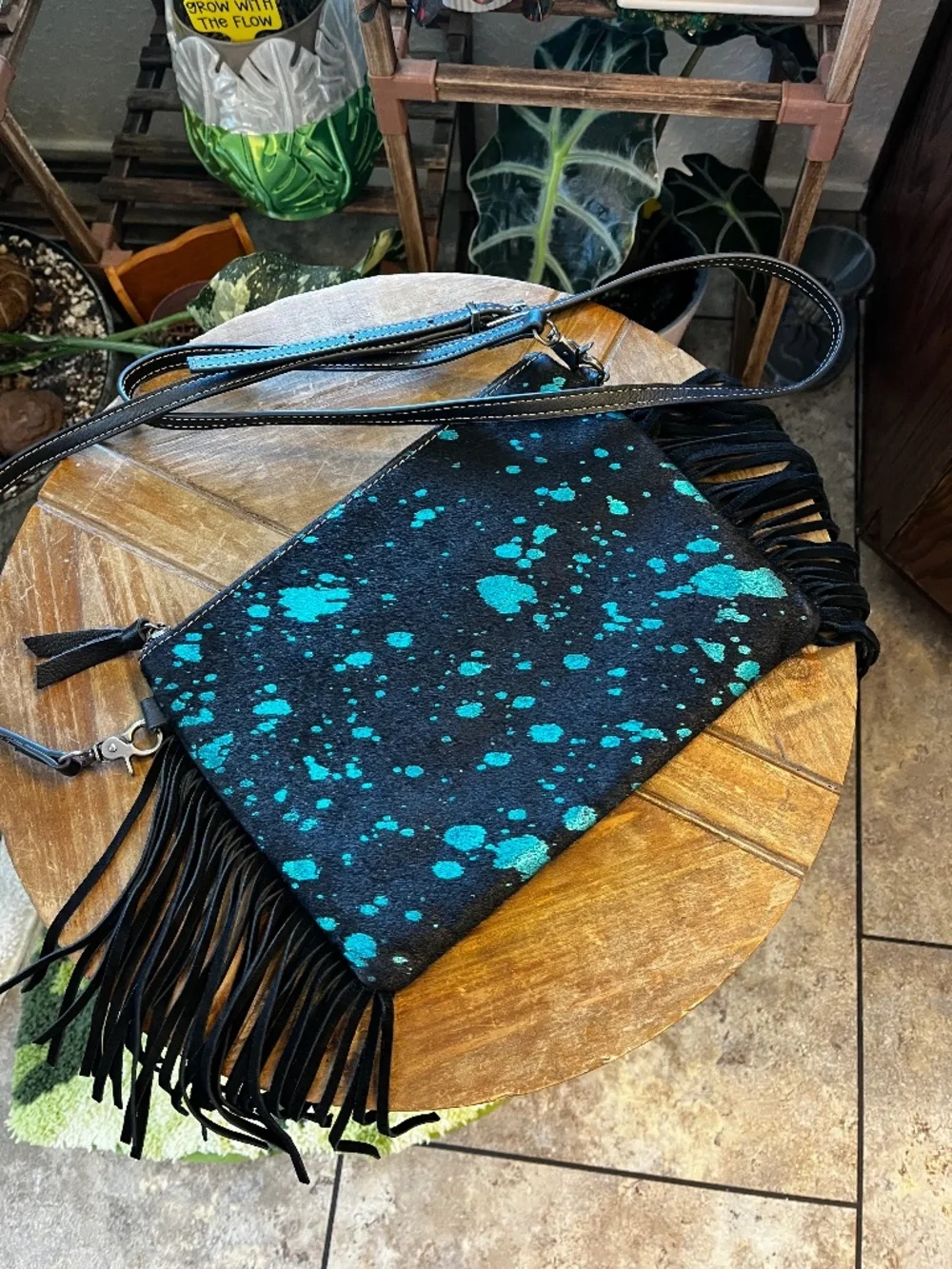 Cowhide leather fringe western handbag.